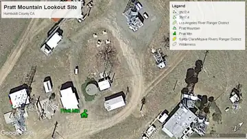 April 2019 image showing intact residence cabin with the lookout on it's side
