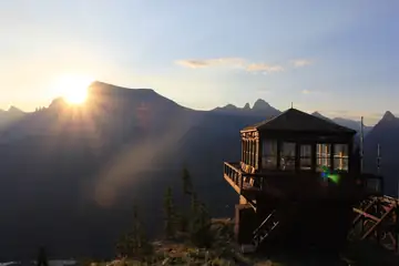 Sun cresting over Mt. Cleveland in August 2017, Porcupine Ridge LO in foreground.